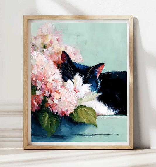 Framed artwork of a black and white cat with pink flowers on a light green background